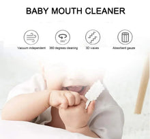 Baby lying down with infant mouth cleaner brush held near tongue