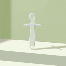 White silicone teething stick with textured chewing head and circular ring handle