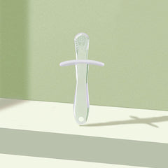 Mint green silicone baby teething stick with ergonomic handle guard and textured tip for soothing gums