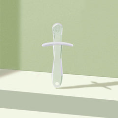 Translucent green silicone baby teething stick with textured tip and safety guard for infants