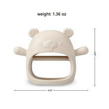 Beige panda-style silicone teething mitten with textured ear nubs and rounded chew ring