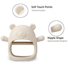 Beige panda-style silicone teething mitten with textured ear nubs and curved chew opening