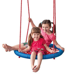 Two girls playing on a blue backyard hanging rope swing seat with red ropes by Huitich