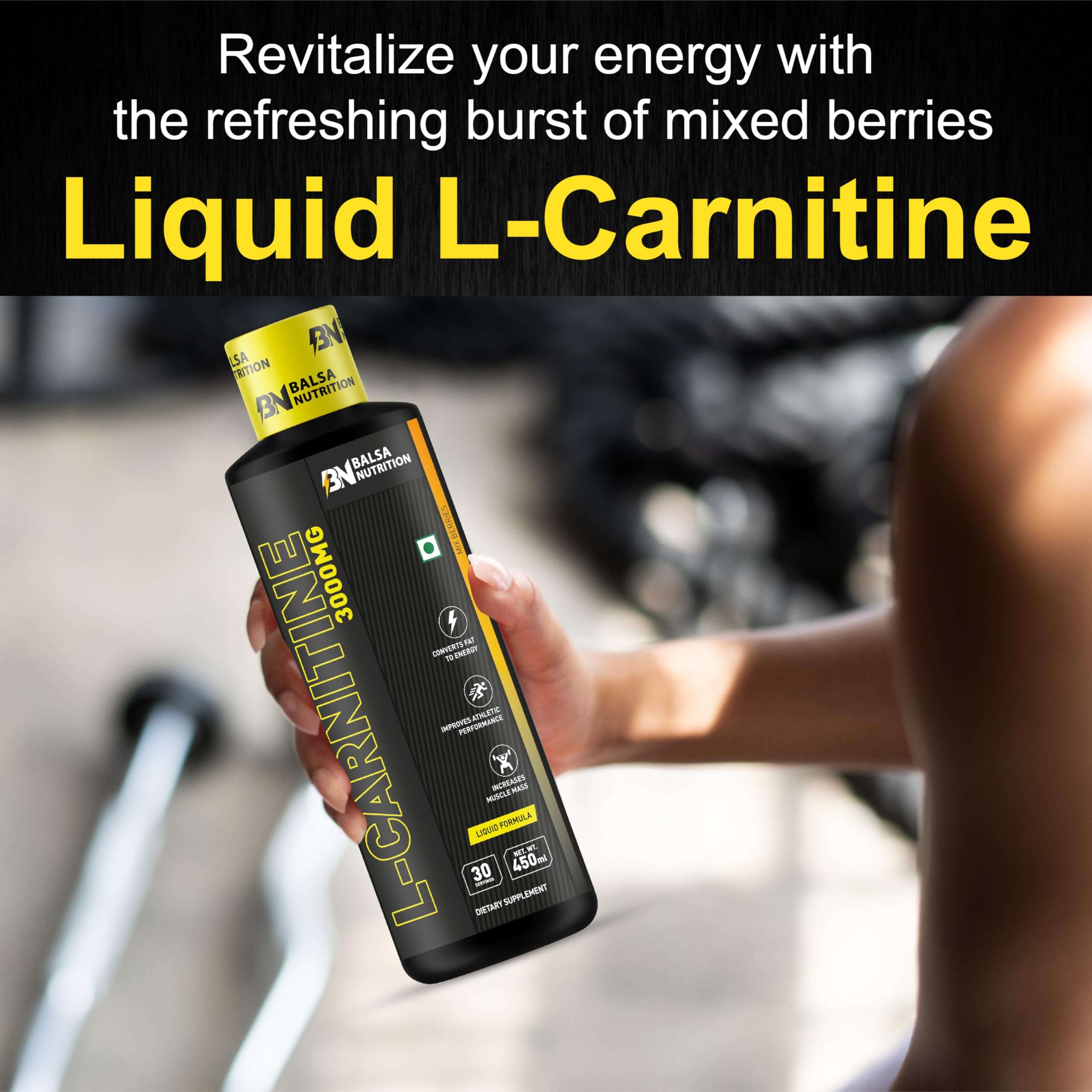 Balsa Nutrition L-Carnitine 3000mg liquid bottle in hand with mixed berry label shown in gym setting