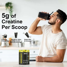 Man drinking from shaker with Balsa Nutrition creatine monohydrate tub nearby