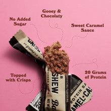 Caramel cashew protein bar with black wrapper and chocolate nut topping