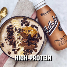 Chocolate protein milkshake bottle beside chocolate dessert bowl