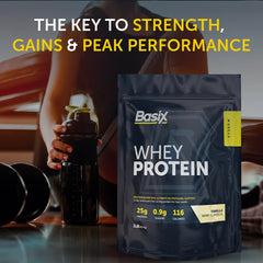 Basix whey protein pouch next to shaker bottle and dumbbell showing nutrition facts vanilla whey protein powder UAE