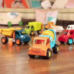 Battat dump truck toy for kids with colorful construction vehicles on wooden floor