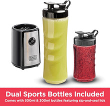 Sports blender with two bottles—lime and red smoothie—with black base