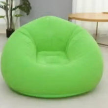 Green inflatable bean bag chair with recessed seat and armrests, front view