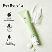 Centella serum tube with silver cap and small cream drops, angled
