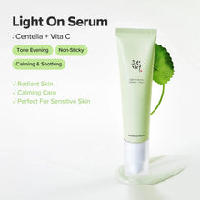 Light On Serum squeeze tube with centella leaf and light green gel smear