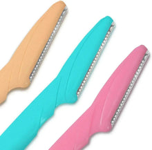 Eyebrow razors with teal, pink, and beige handles, each with a metal blade