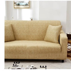 Huitich beige elastic sofa cover stretched over a three-seat sofa with matching pillows in a modern living room