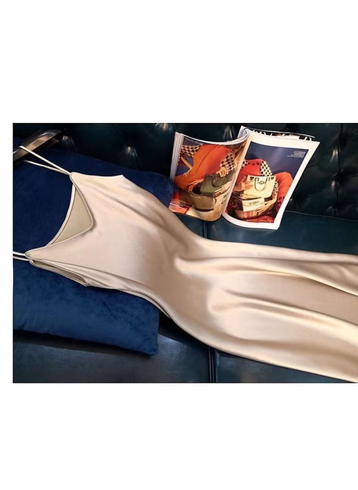 Huitich beige sleeveless satin dress XL laid on dark blue pillow and black leather couch
