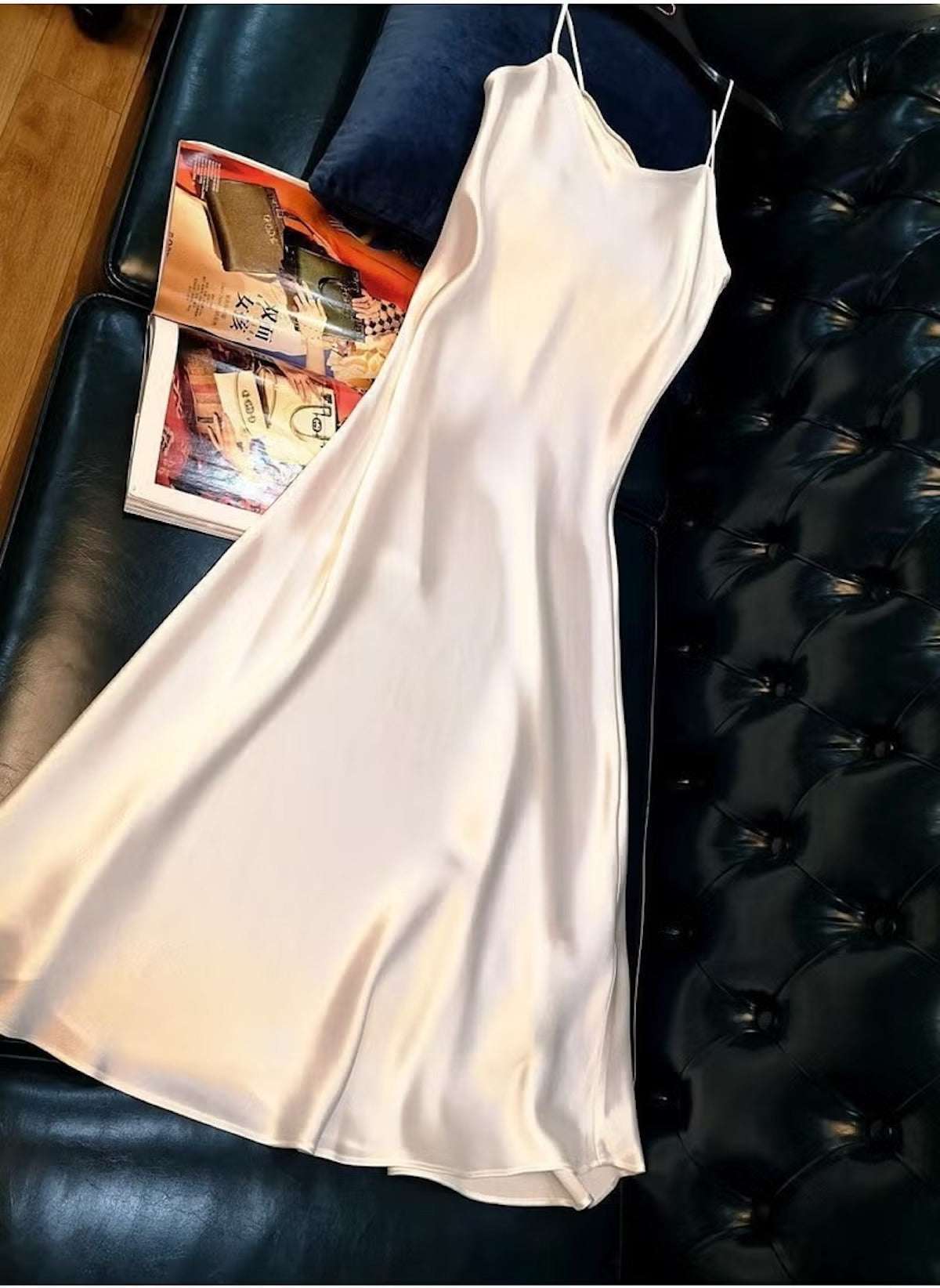 Huitich beige sleeveless satin dress XL laid out on black leather sofa with a magazine