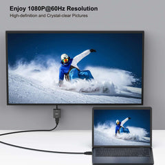 BENFEI HDMI to VGA adapter with audio connecting laptop to monitor displaying snowboarder in high definition