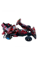 Kids go-kart with safety belt, red and black camo, side view with handle and wheels