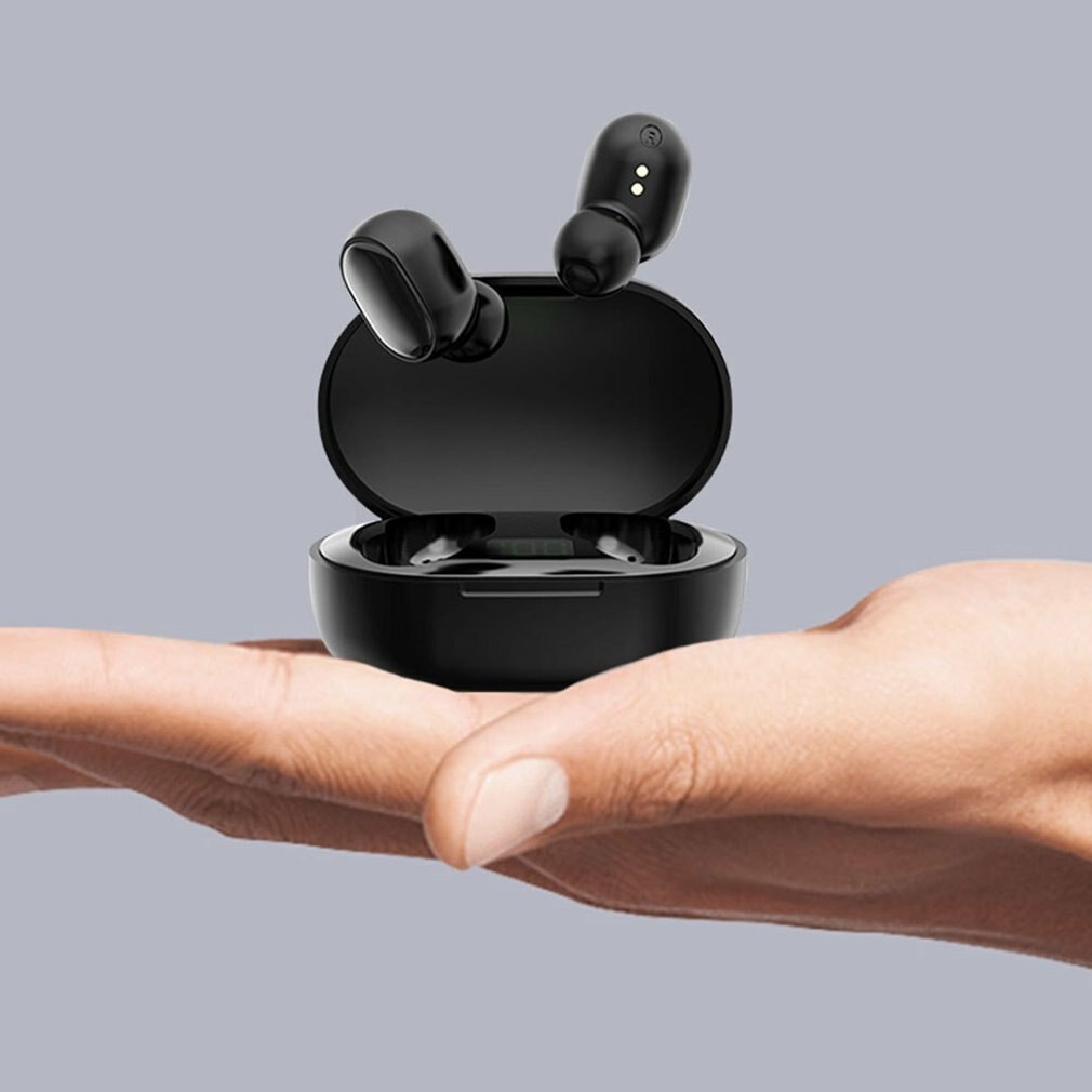 Huitich wireless earbuds in black with charging case held in hand best true wireless earbuds for gaming