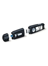 Blood glucose monitor with test strip partly inserted, digital reading on screen.