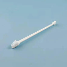 White dog toothbrush with bristled head and long handle