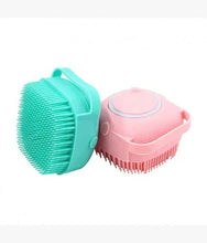 Massage brush set with round teal silicone head and pink bristle attachment