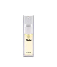 Pet perfume spray bottle with pale yellow liquid and white flip-top nozzle