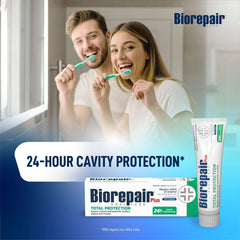 Smiling couple brushing teeth with Biorepair toothpaste UAE packaging and tube displaying 24 hour cavity protection