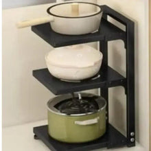 3-shelf pot rack organizer with black shelves holding cookware and a green pot