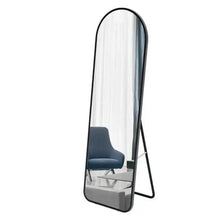 Full-length floor mirror with black aluminum arched frame and standing legs