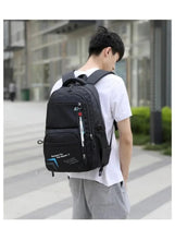 Kids 6-wheel school backpack worn on back, black with blue logo and front zippers