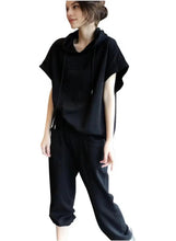 Women’s black lounge set with short-sleeve hoodie and relaxed jogger pants