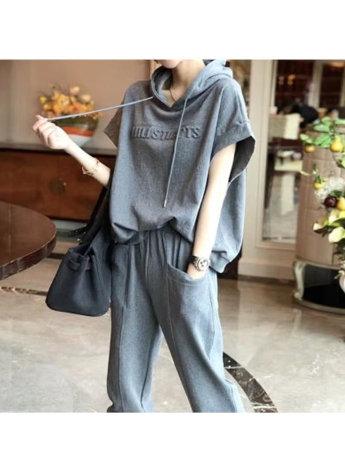 Huitich black and grey lounge set UAE for women featuring a sleeveless hoodie and matching pants