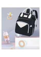 Baby travel backpack with side zippers, white contrast front panel, and adjustable straps