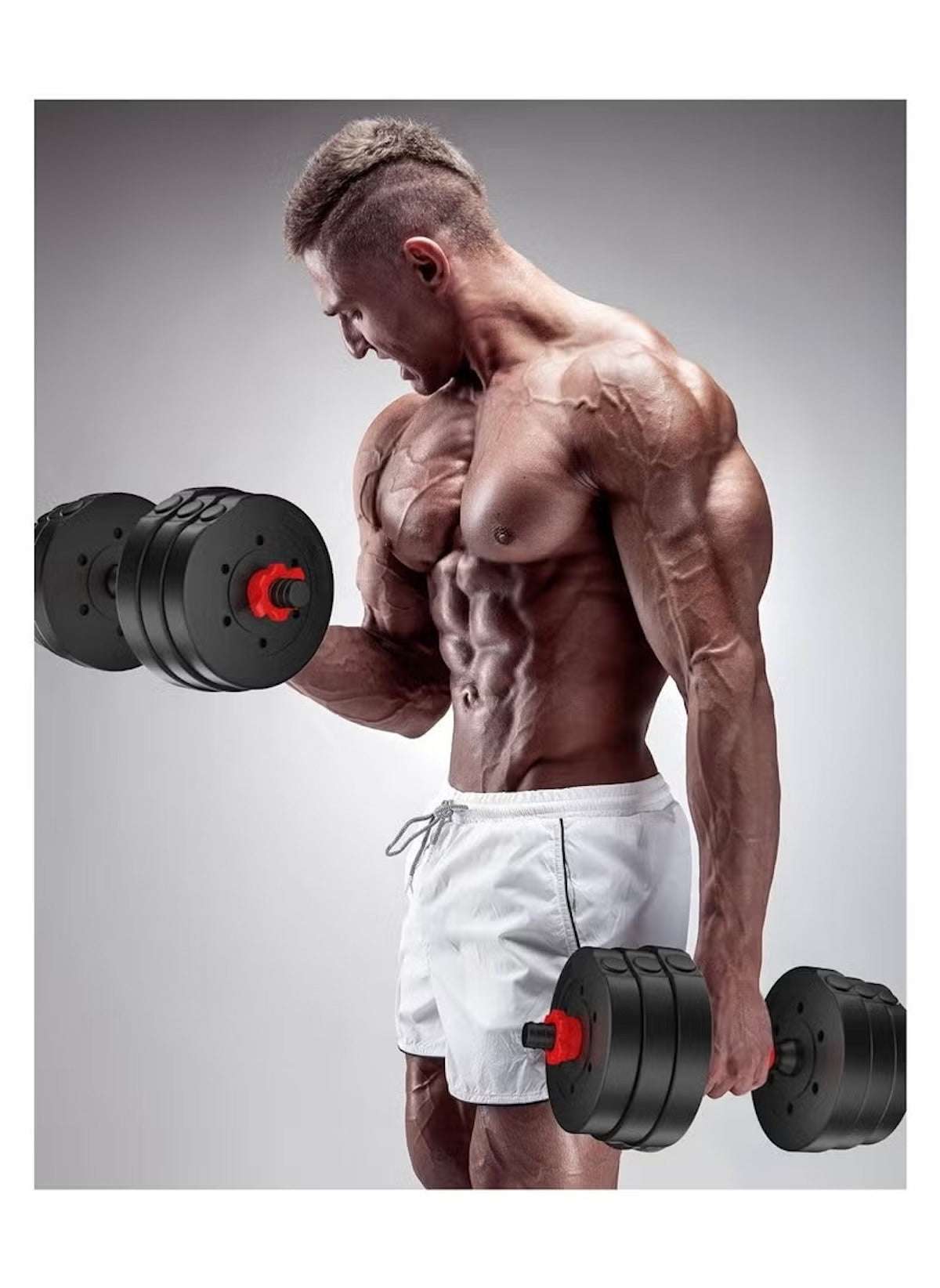 Muscular man lifting black heavy duty dumbbells for home gym wearing white shorts