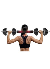 Woman lifting black heavy duty dumbbells for home gym with a padded bar in a fitness workout