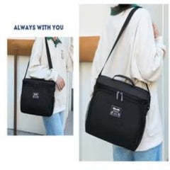 Huitich black leak proof lunch box with adjustable shoulder strap carried by person