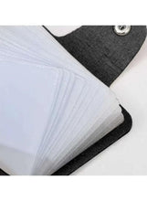 Black card holder wallet close-up of interior card slots under snap flap