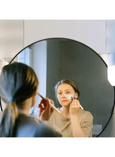Black round wall mirror with bright ring edge lighting