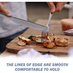 Huitich black stainless steel cutlery set cutting grilled chicken on wooden board with smooth edges