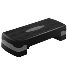 Black exercise step platform with grippy textured surface and side supports