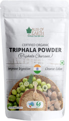 BLISS OF EARTH organic triphala powder for detox pouch showing powder and amla haritaki bibhitaki fruits