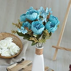 Huitich blue artificial flower bouquet in a white vase with green leaves and delicate petals