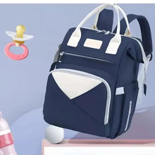 Navy diaper backpack with white trim, front zip pocket and wide open front compartment