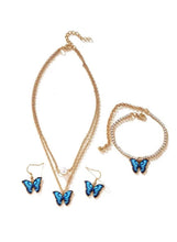 Butterfly jewelry set with blue enamel butterflies and gold-tone chain necklace, bracelet, earrings