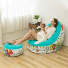 Turquoise and white graffiti air chair with molded backrest and cartoon print base.