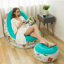 Turquoise graffiti air chair with molded backrest and comic print sides; matching small ottoman.