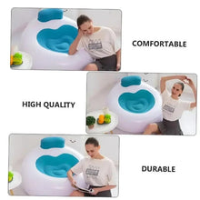 Inflatable lounge chair with teal backrest and blue seat, person relaxing indoors