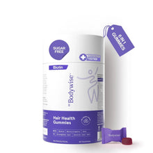 Sugar-free biotin hair gummies bottle with purple gummies and small sachet